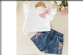 Girl jeans shorts with a blouse